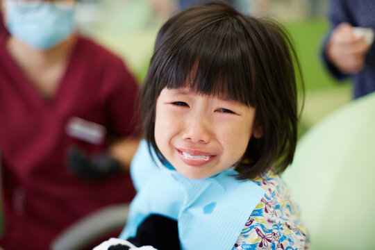 Asian little girl just finished tooth extraction in hospital