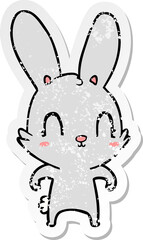 distressed sticker of a cute cartoon rabbit