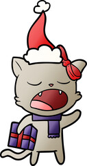gradient cartoon of a cat with christmas present wearing santa hat