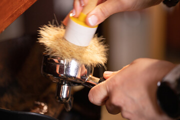 Professional barista preparing coffee. Young woman making coffee. Alternative ways of brewing coffee. Coffee shop concept