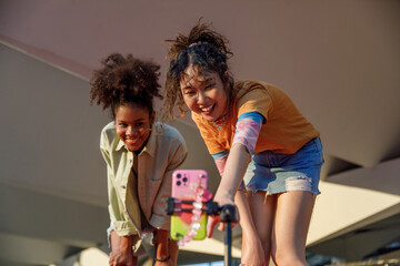 Two teens setting up phone video