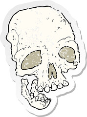 retro distressed sticker of a cartoon ancient spooky skull