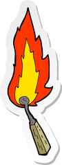 sticker of a cartoon burning match