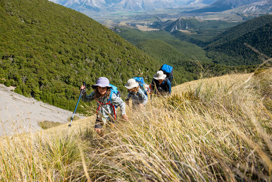 Family walking in the mountain, Craigieburn Range, New Zealand.