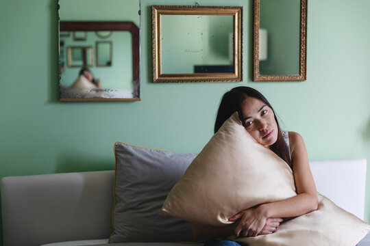 Woman hugging pillow