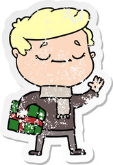 distressed sticker of a cartoon man carrying christmas present waving