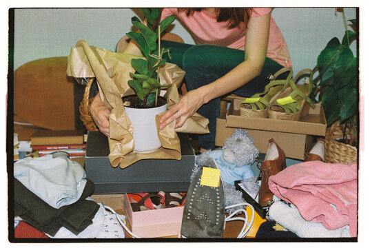 Flea market atmosphere, lots of second hand items and a vendor.