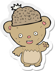 sticker of a cartoon bear in hat