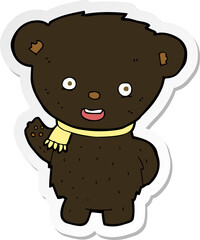 sticker of a cartoon black bear waving