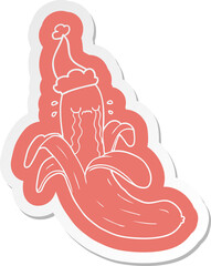 cartoon  sticker of a crying banana wearing santa hat