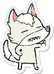 distressed sticker of a cartoon wolf showing teeth