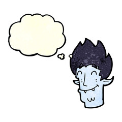 cartoon happy vampire head with thought bubble