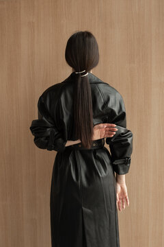 Back side portrait of brunette in minimalist pose
