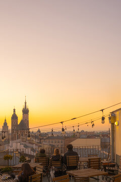A postcard with a beautiful sunset view of the old European city