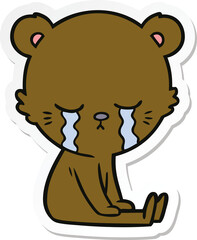sticker of a crying cartoon bear