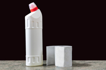 white plastic container for household chemicals and paper roll on a wooden surface - 593714624