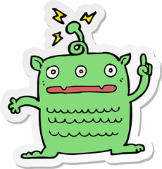 sticker of a cartoon weird little alien