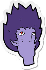 sticker of a cartoon vampire face
