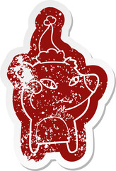 cute cartoon distressed sticker of a bear wearing santa hat