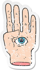 retro distressed sticker of a cartoon spooky hand with eyeball