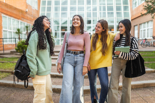 female student friends in front of the faculty at the university