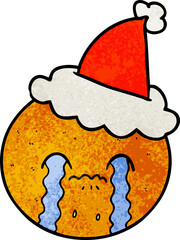 textured cartoon of a orange wearing santa hat