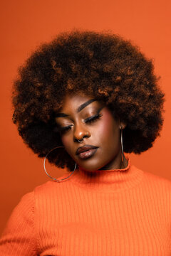 Serious black woman with curly afro hair