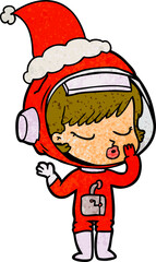 textured cartoon of a pretty astronaut girl wearing santa hat