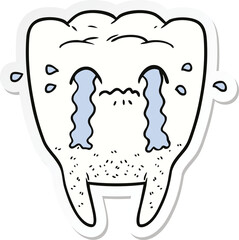 sticker of a cartoon tooth crying