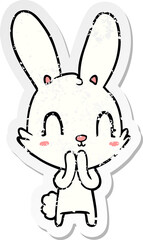 distressed sticker of a cute cartoon rabbit