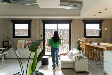 Woman unpacking box at home