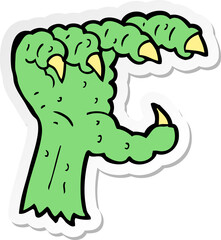 Obraz premium sticker of a cartoon monster claw