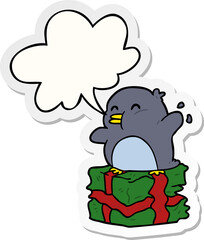 cartoon penguin on wrapped present and speech bubble sticker