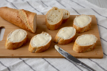 Homemade Bread and Butter on a bamboo board, low angle view.
