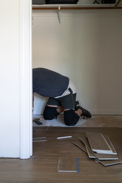 Person installing a wood floor