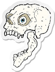 retro distressed sticker of a cartoon scary skull