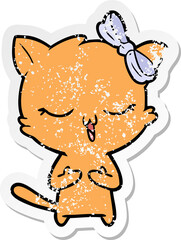Obraz na płótnie Canvas distressed sticker of a cartoon cat with bow on head