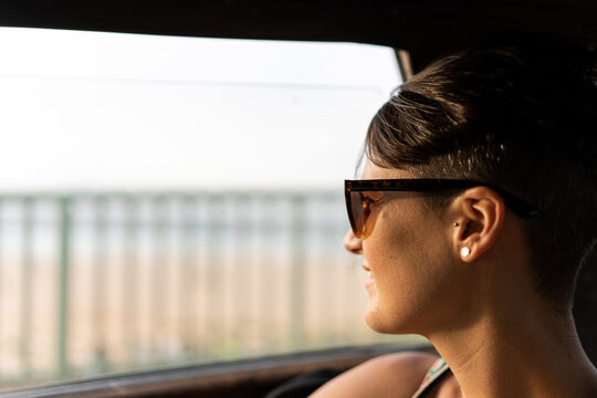 woman in car looking down the street