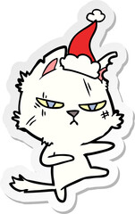 tough sticker cartoon of a cat wearing santa hat