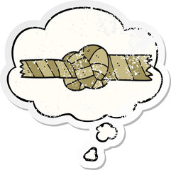 cartoon knotted rope and thought bubble as a distressed worn sticker