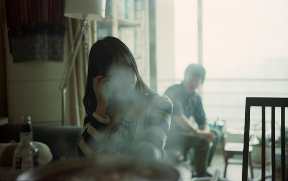 The girl sat in the smoke