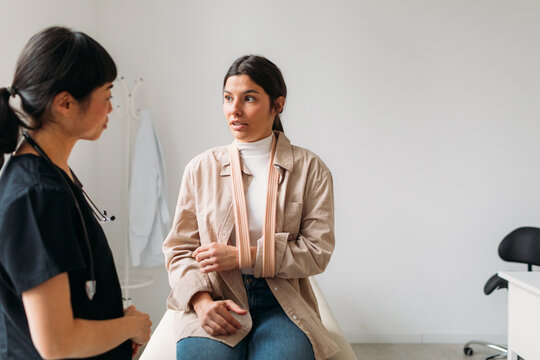 Female Doctor Examining Young Woman