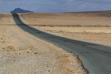 Endless straight road through the Namib desert in Namibia, Africa