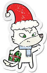 distressed sticker of a friendly cartoon christmas wolf