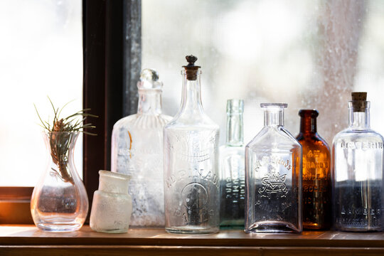 Thrifted jars on a windowsill in natural light