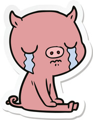 sticker of a cartoon pig crying