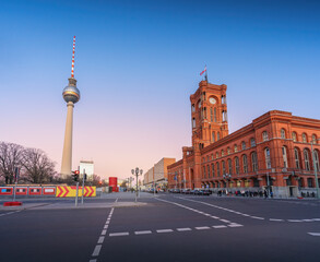 Fototapeta premium Berlin City Hall (Rotes Rathaus) and TV Tower (Fernsehturm) at sunset - Berlin, Germany