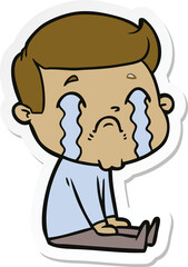 sticker of a cartoon man crying