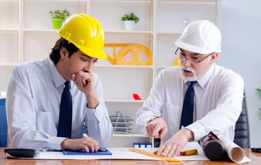 Two engineers colleagues working under project