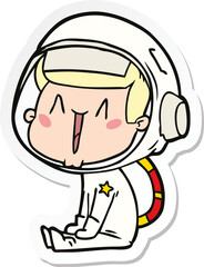 sticker of a happy cartoon astronaut sitting